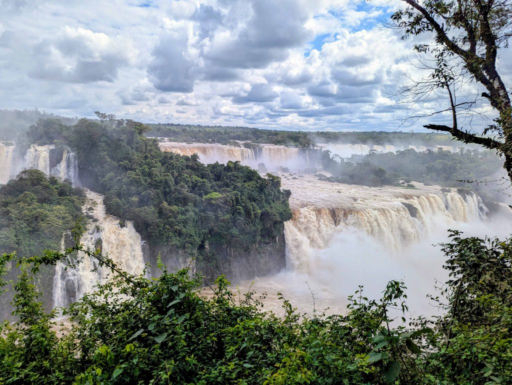 Panoramic view of cascading waterfalls and dense subtropical rainforest along the Iguazu gorge