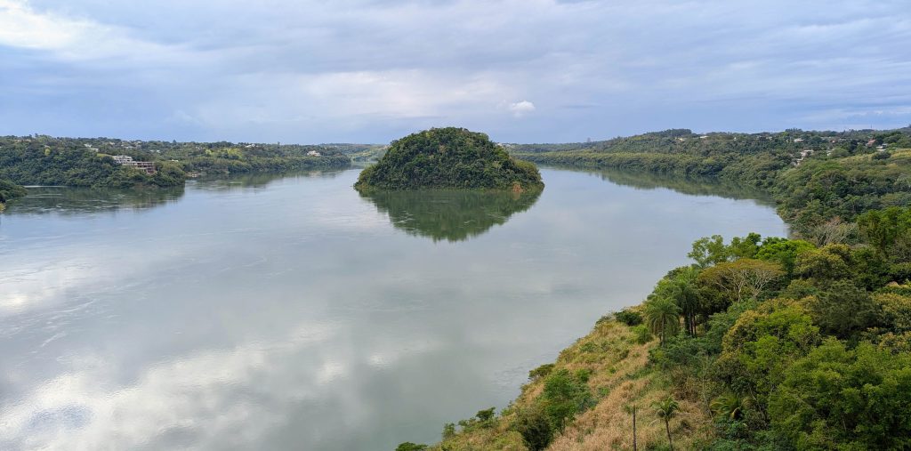 Wide view across the Parana River and lush shoreline from the international Friendship Bridge