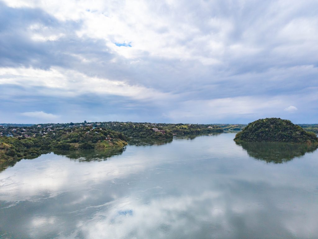 Lush green islands and forested banks along the Parana River between Brazil and Paraguay