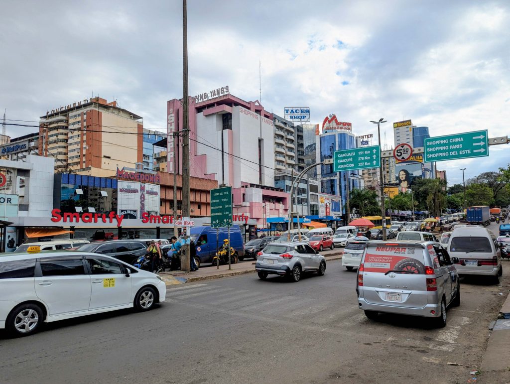 Busy commercial avenue lined with electronics shopping malls in Ciudad del Este Paraguay