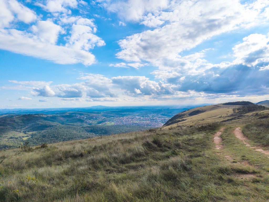 High mountain ridge viewpoint overlooking rolling green valleys in the Minas Gerais highlands