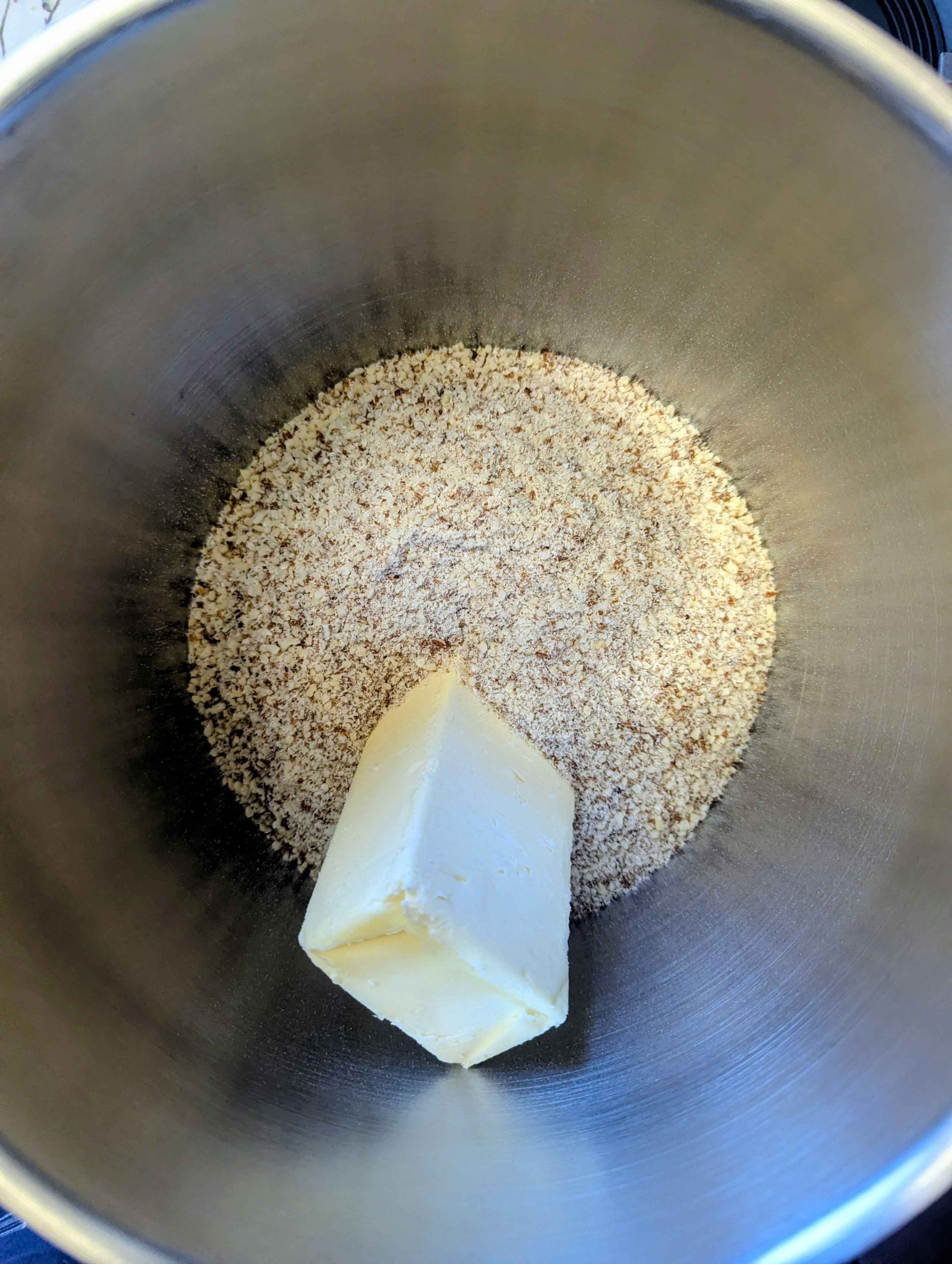 Linzertorte ingredients and butter cubes in mixing bowl