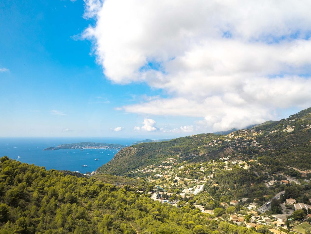 Scenic coastal overlook from Eze mountains across pine forests toward the Cap Ferrat peninsula