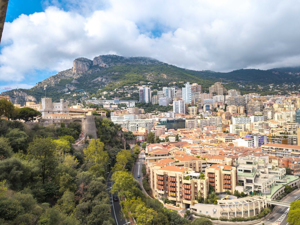 Fortress ramparts and watchtower of the Prince Palace of Monaco perched on the rocky cliffs of Le Rocher