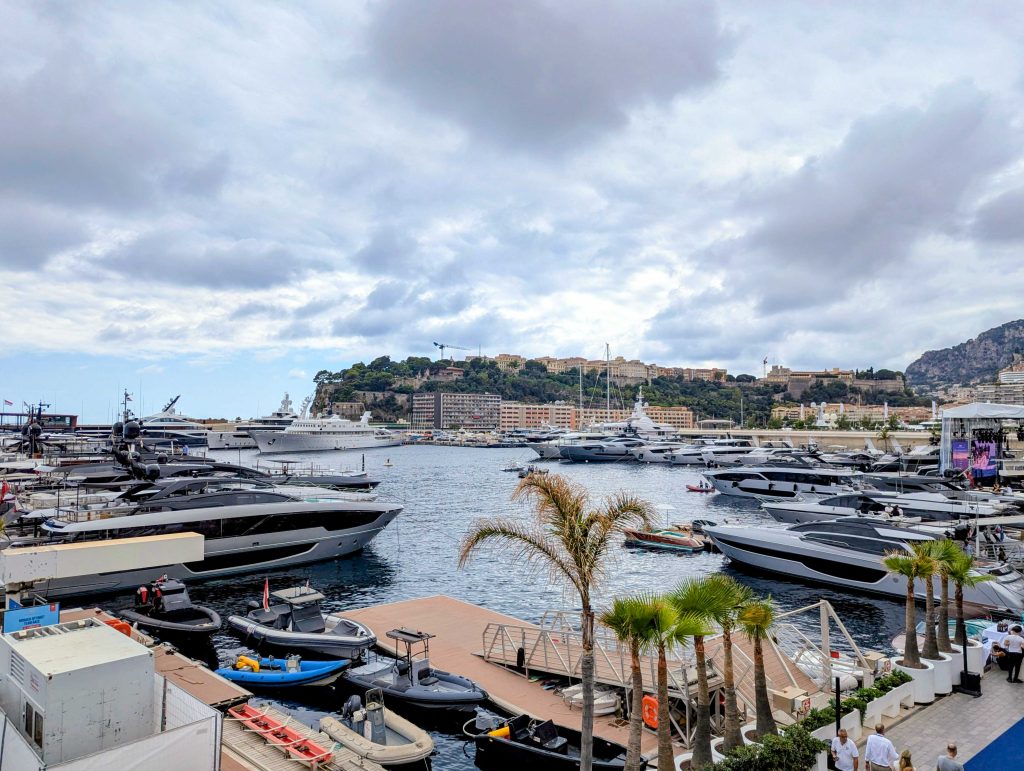 Luxury yachts and event pavilions along the waterfront promenade at Port Hercule in Monaco
