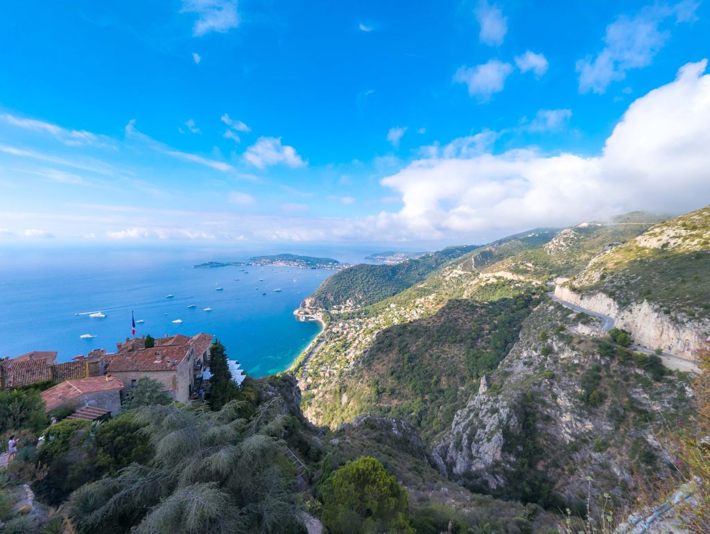High vantage point from Eze cliffs looking out over azure Mediterranean waters toward the Cap Ferrat peninsula